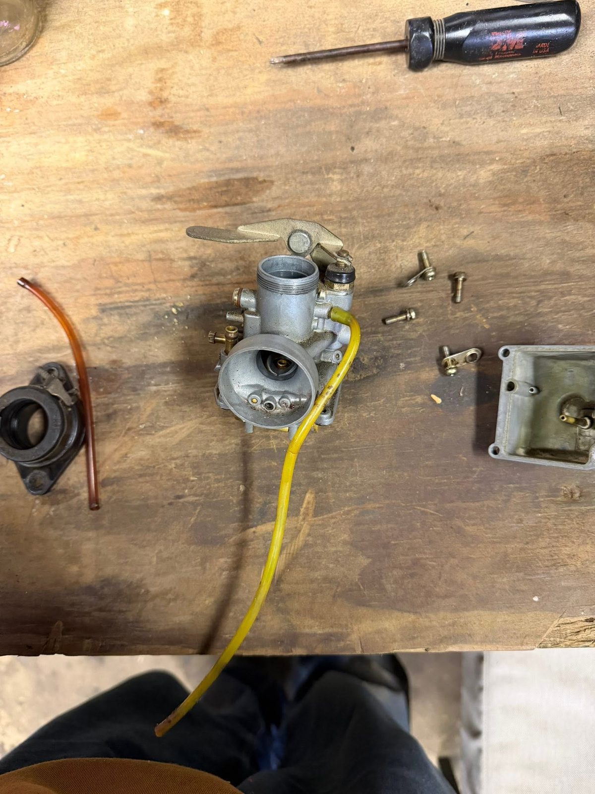 Carburetor disassembled on the workbench